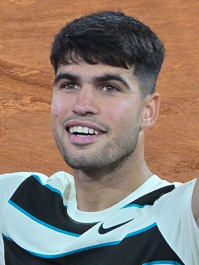Carlos Alcaraz celebrating a tennis victory