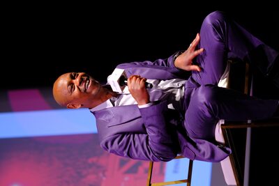 Dave Chappelle performing stand-up comedy