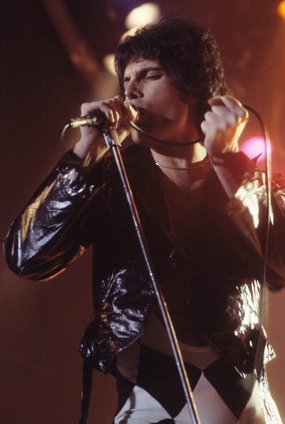 Freddie Mercury performing on stage
