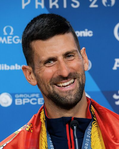 Novak Djokovic celebrating on a tennis court